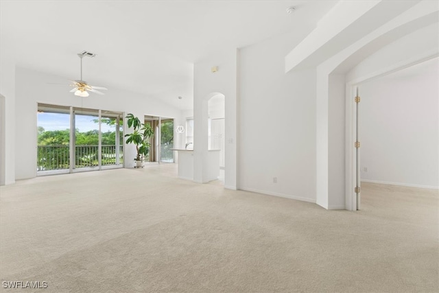 unfurnished living room with ceiling fan and light carpet