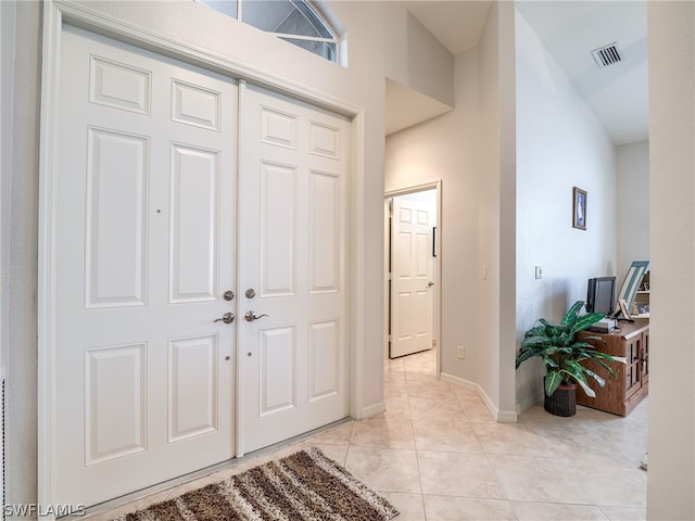 entryway featuring light tile patterned flooring