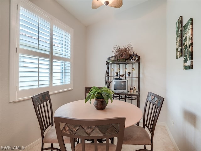 tiled dining room with ceiling fan