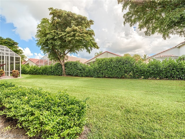 view of yard featuring a lanai