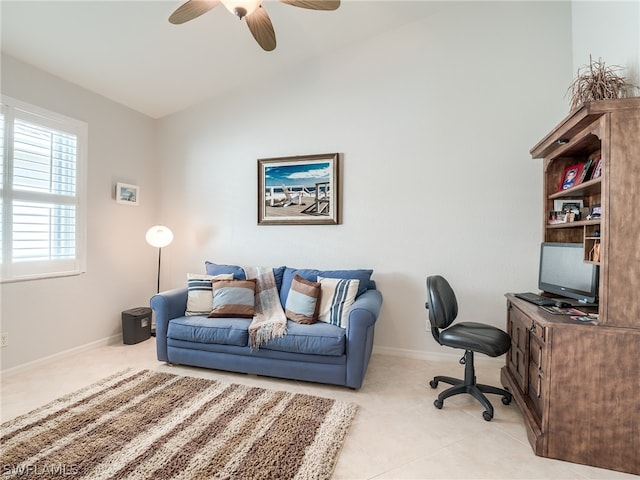 tiled home office featuring ceiling fan