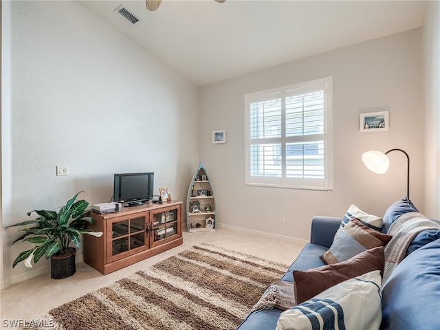 living room featuring lofted ceiling