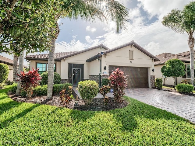 view of front of house with a garage and a front yard