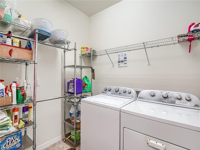 laundry area with independent washer and dryer