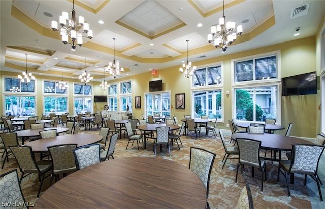 dining area featuring an inviting chandelier, beamed ceiling, a towering ceiling, and coffered ceiling