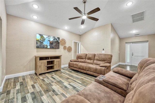 living room with wood-type flooring, ceiling fan, and lofted ceiling