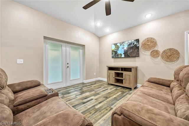 living room with ceiling fan, french doors, hardwood / wood-style flooring, and lofted ceiling