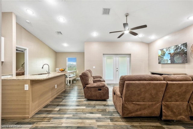 living room with french doors, dark hardwood / wood-style flooring, ceiling fan, vaulted ceiling, and sink