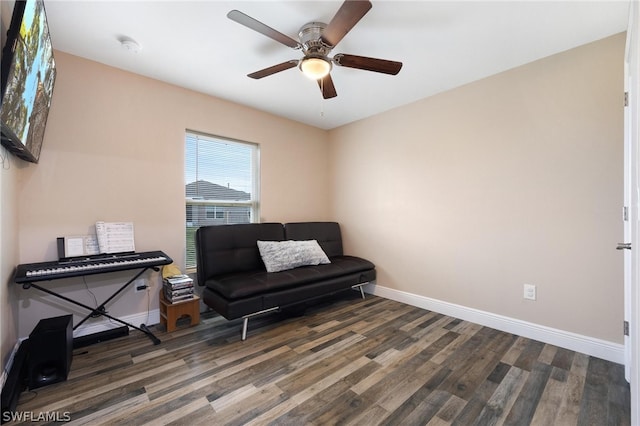 living area with ceiling fan and hardwood / wood-style flooring