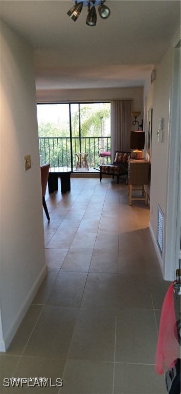 hallway featuring tile patterned flooring