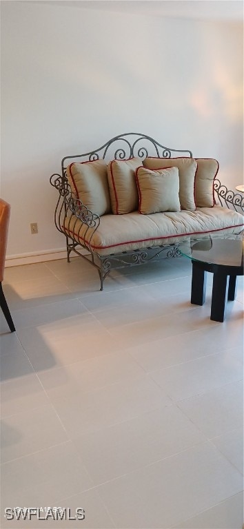 living area with tile patterned floors