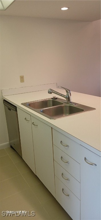 kitchen featuring dishwasher, light tile patterned floors, and sink