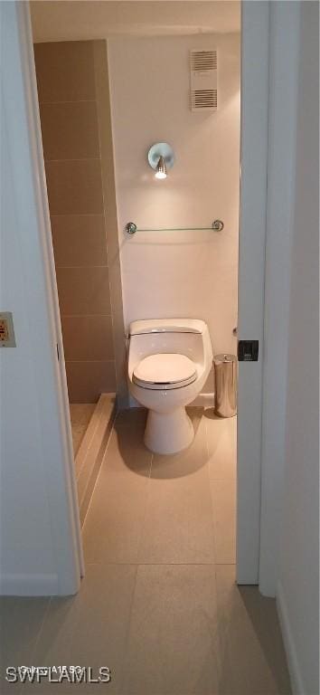 bathroom with tile patterned flooring and toilet