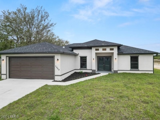 prairie-style house featuring stucco siding, an attached garage, concrete driveway, and a front lawn