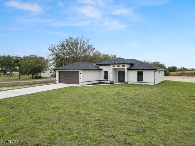 view of front facade featuring a garage and a front lawn