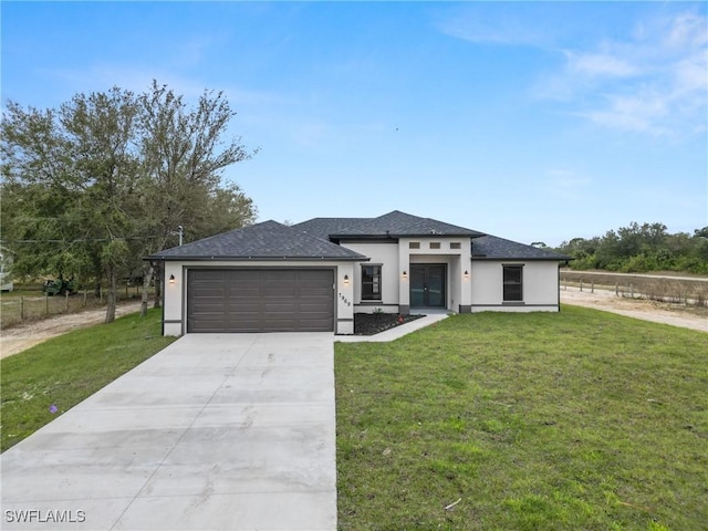 prairie-style house with a shingled roof, stucco siding, a front lawn, concrete driveway, and a garage