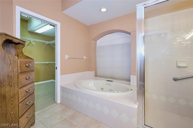 bathroom with tile patterned floors and plus walk in shower