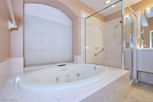 bathroom featuring independent shower and bath and tile patterned floors