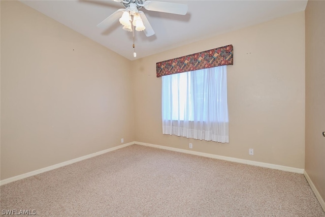 empty room featuring carpet, lofted ceiling, and ceiling fan