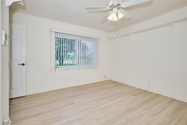 unfurnished room featuring ceiling fan and light wood-type flooring