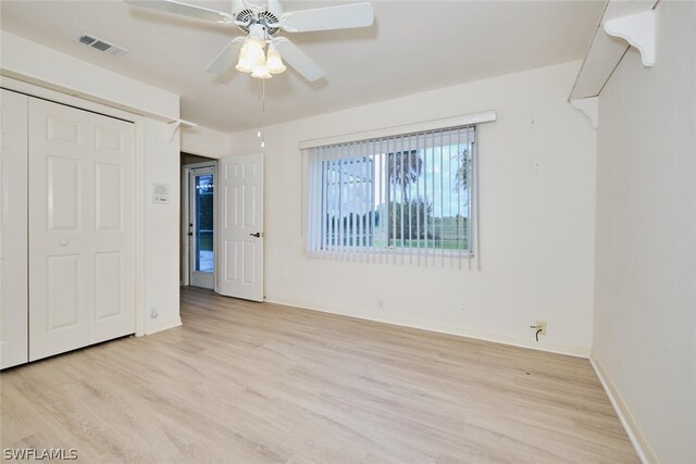 unfurnished bedroom featuring ceiling fan and light wood-type flooring