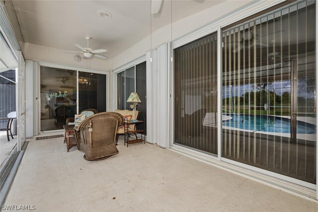 sunroom / solarium with ceiling fan