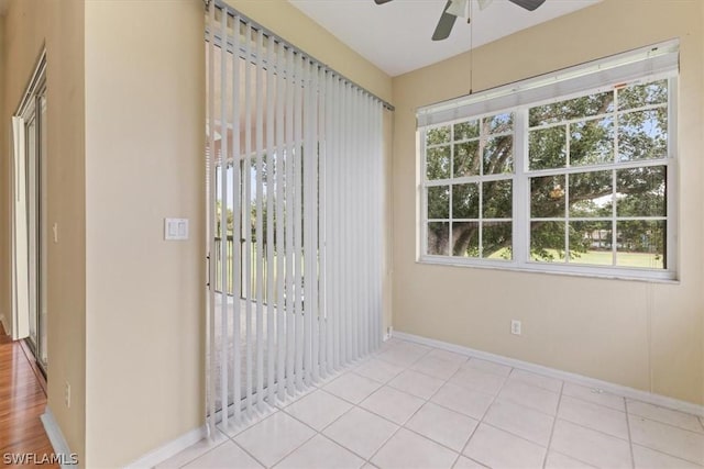 unfurnished sunroom with a healthy amount of sunlight and ceiling fan