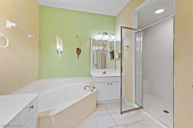 bathroom with shower with separate bathtub, tile patterned floors, and vanity