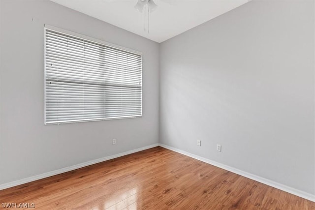 spare room with ceiling fan and light hardwood / wood-style floors