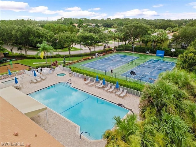 view of pool featuring a patio area and tennis court