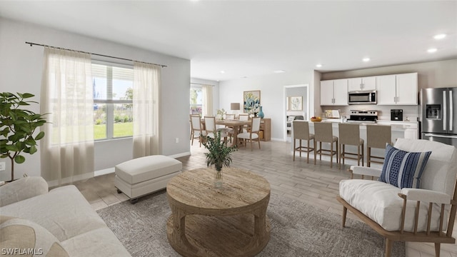 living room with light hardwood / wood-style floors