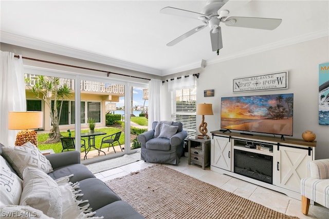 living room featuring crown molding, light tile patterned floors, and ceiling fan