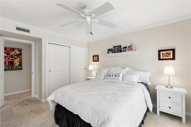 tiled bedroom featuring ornamental molding, a closet, and ceiling fan