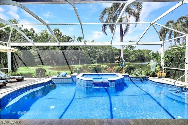 view of swimming pool featuring an in ground hot tub, glass enclosure, and a patio area