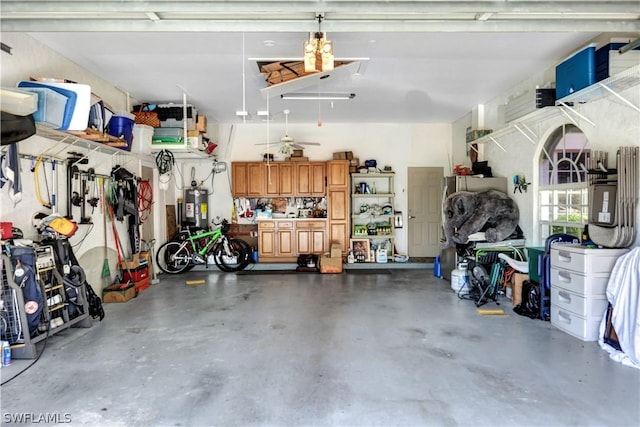 garage featuring water heater and a workshop area