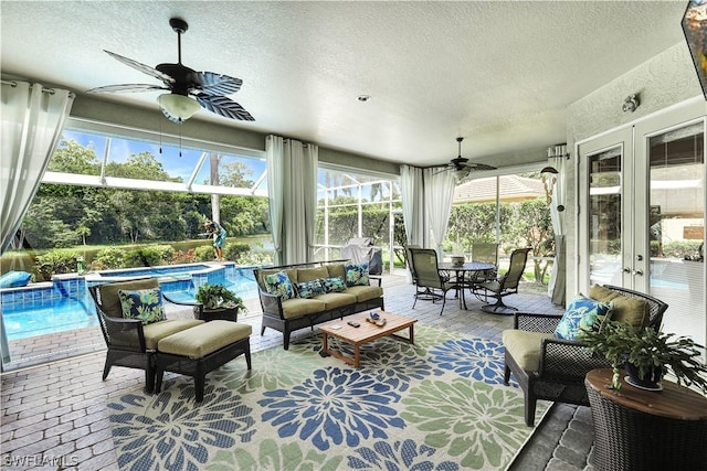 sunroom with ceiling fan