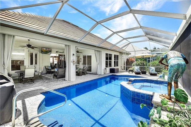 view of swimming pool featuring a lanai, an in ground hot tub, ceiling fan, an outdoor living space, and a patio