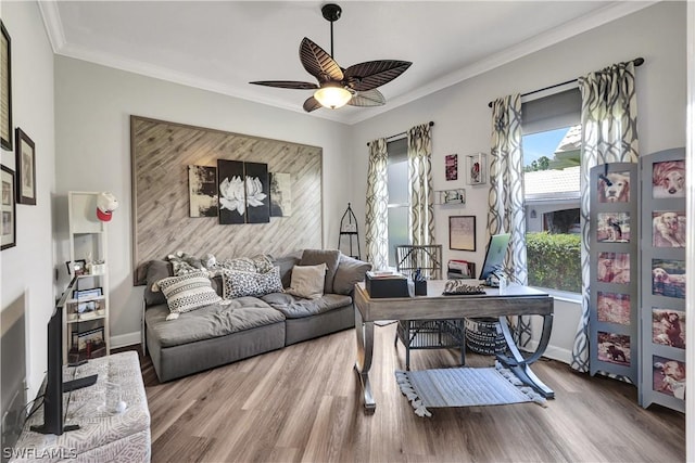 office with hardwood / wood-style flooring, crown molding, and ceiling fan