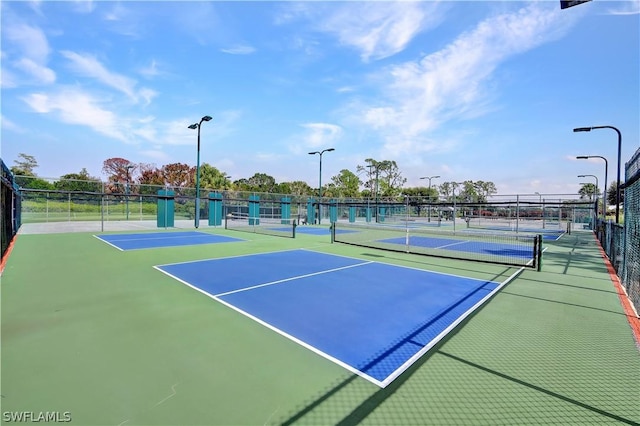 view of sport court with basketball hoop