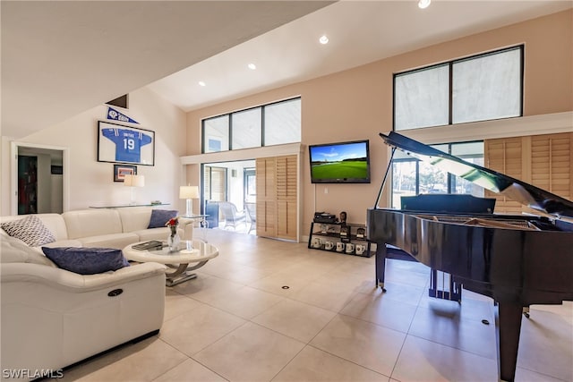 living room with light tile patterned floors and a towering ceiling