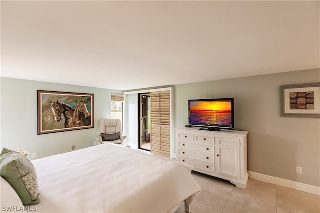 bedroom featuring light tile patterned floors