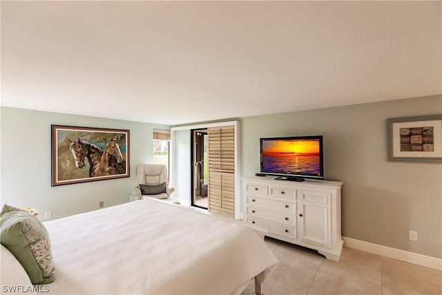 4515 Windjammer Ln, Fort Myers, FL 33919 - bedroom with baseboards and light tile patterned floors