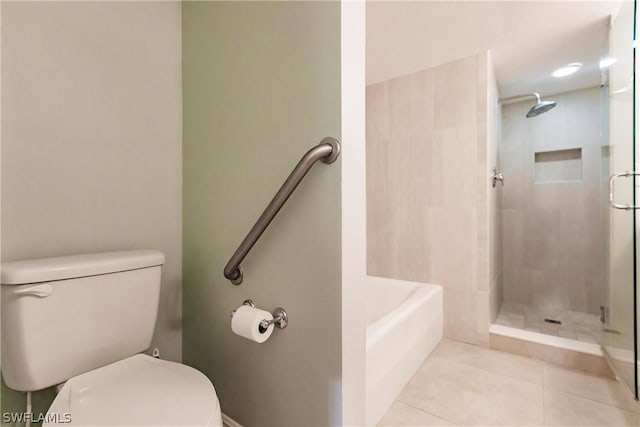 bathroom featuring tile patterned flooring, independent shower and bath, and toilet