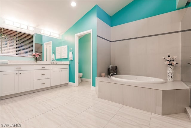 bathroom featuring tiled bath, tile patterned floors, double vanity, vaulted ceiling, and toilet