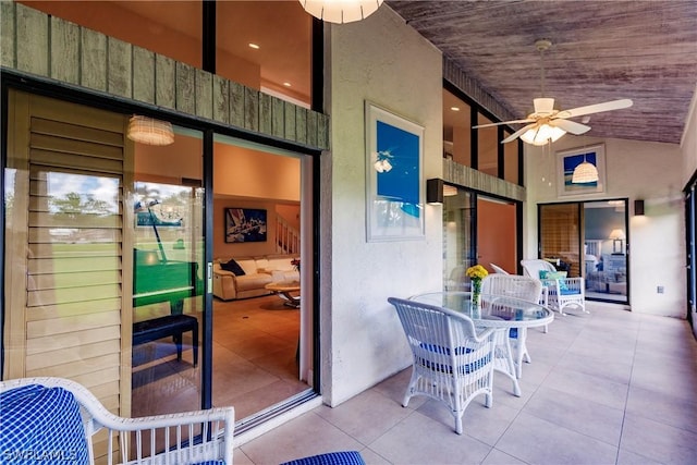 interior space with lofted ceiling, wooden ceiling, and ceiling fan