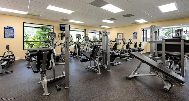 exercise room with a drop ceiling