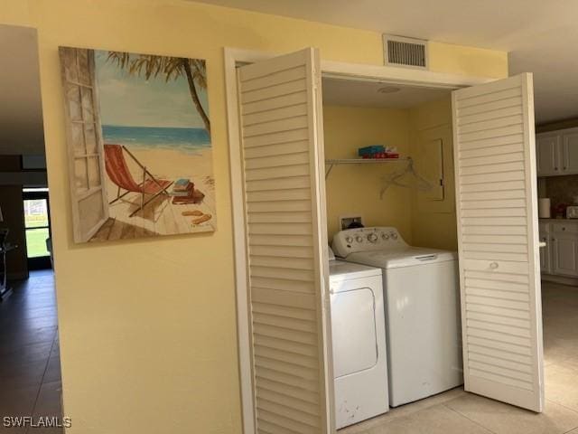 4515 Windjammer Ln, Fort Myers, FL 33919 - laundry area with light tile patterned flooring, laundry area, visible vents, and independent washer and dryer