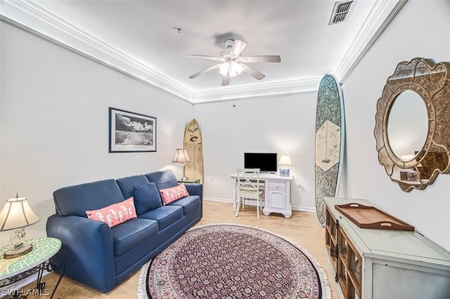 living room with ceiling fan and ornamental molding