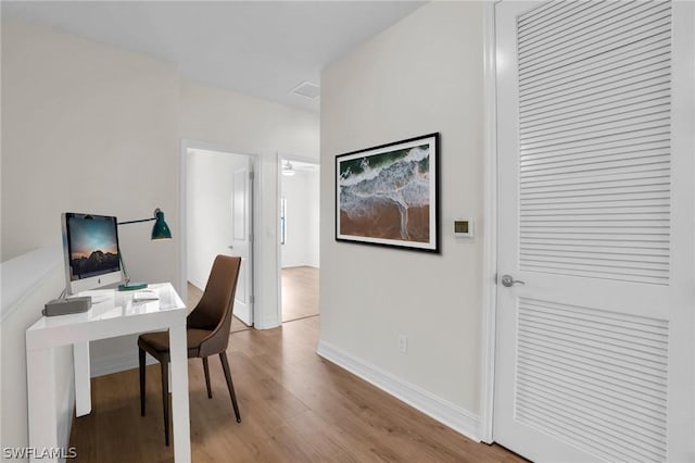 office space with light hardwood / wood-style floors