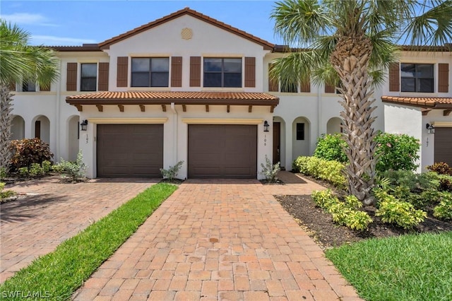 mediterranean / spanish-style home featuring a garage